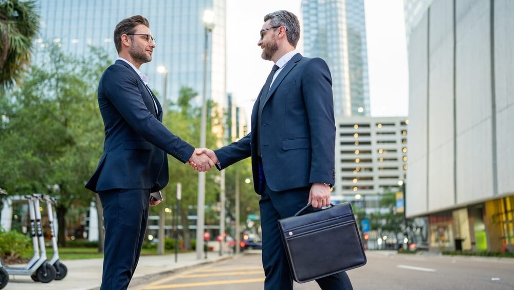Business Man Shaking Hands. Two Businessmen Handshake Outdoor